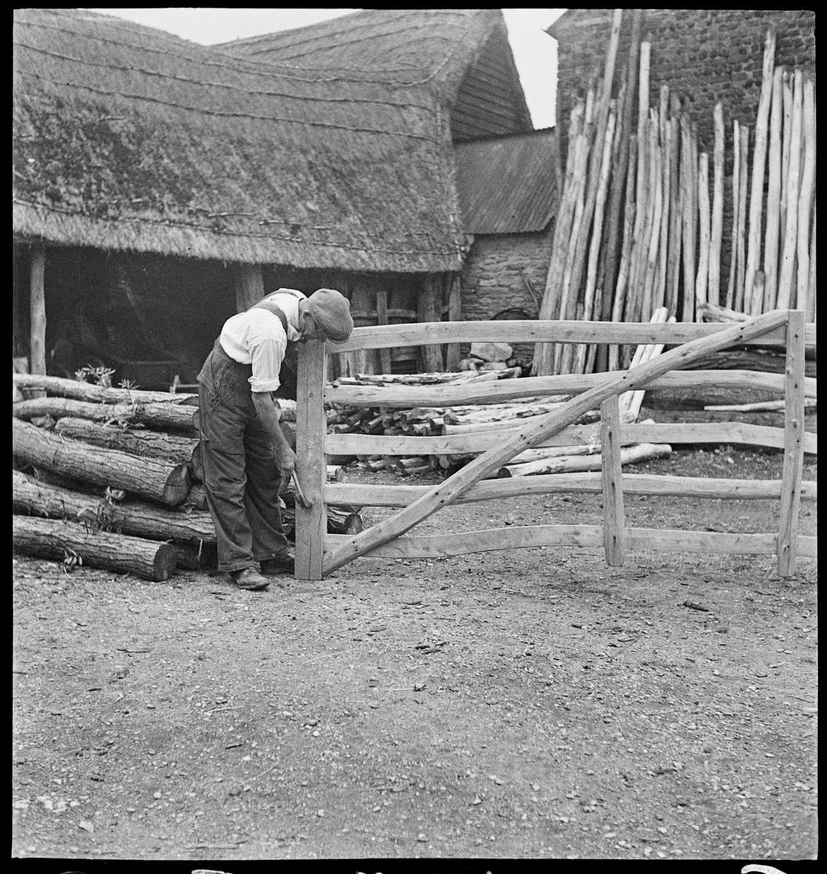 A man making a field gate in Aston, 1930-50 by George R. Long