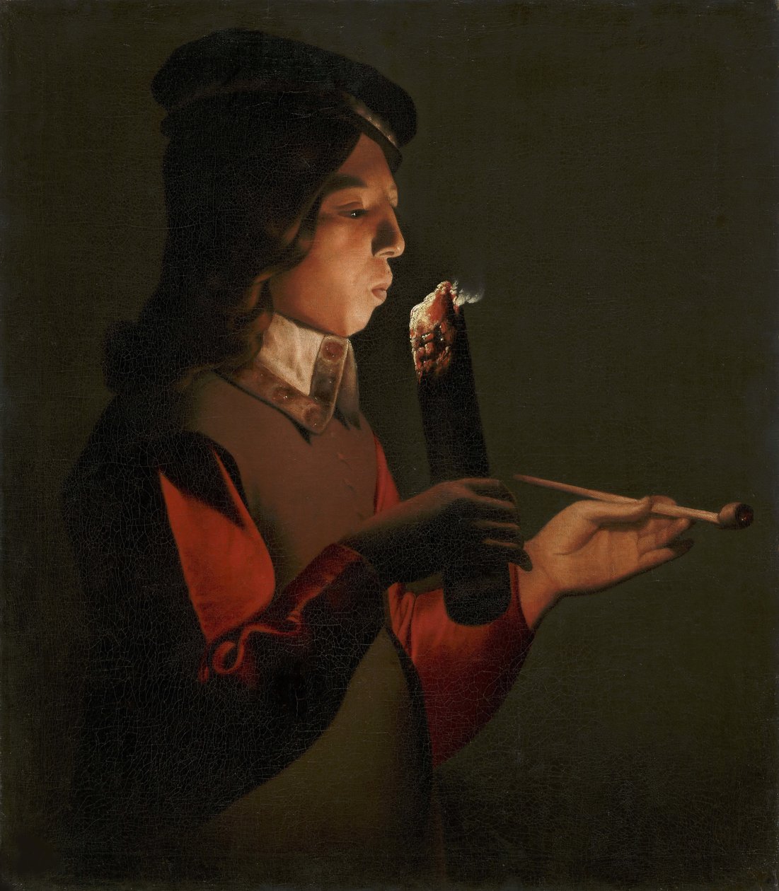 A Young Boy with a Pipe, Blowing on a Firebrand by Georges de La Tour