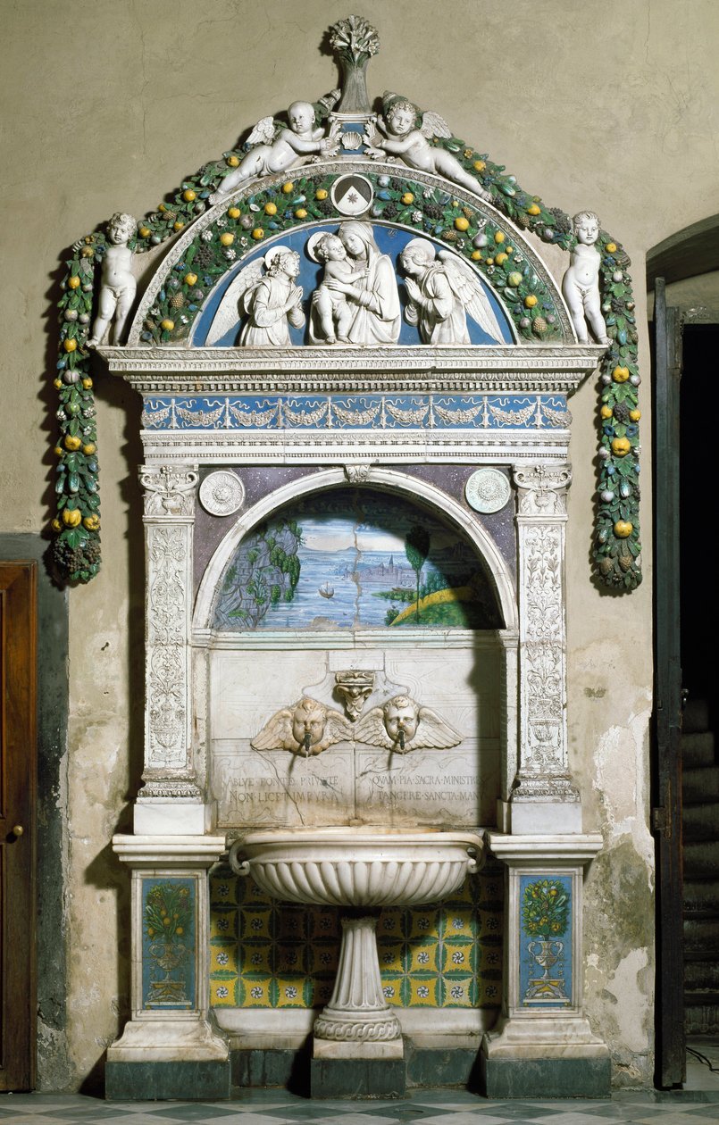 Decorated fountain with a high relief in marble and terracotta by Giovanni della Robbia. Sacristy of Santa Maria Novella, Florence by Giovanni della Robbia