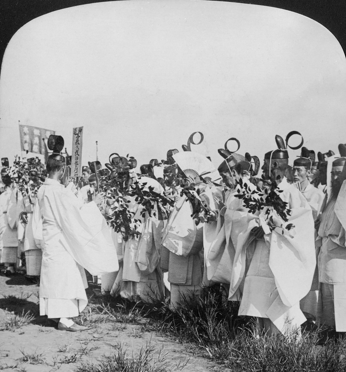 Shinto priests in a funeral procession for Hitachi Maru victims, Tokyo, Japan by H. C. White