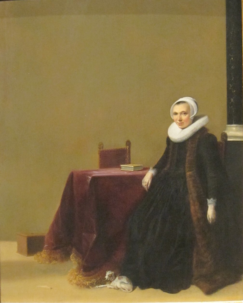 Portrait of a Woman with a Dog by Hendrik Gerritsz Pot