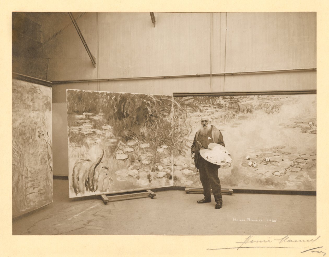 Claude Monet (1840-1926) in front of his paintings 