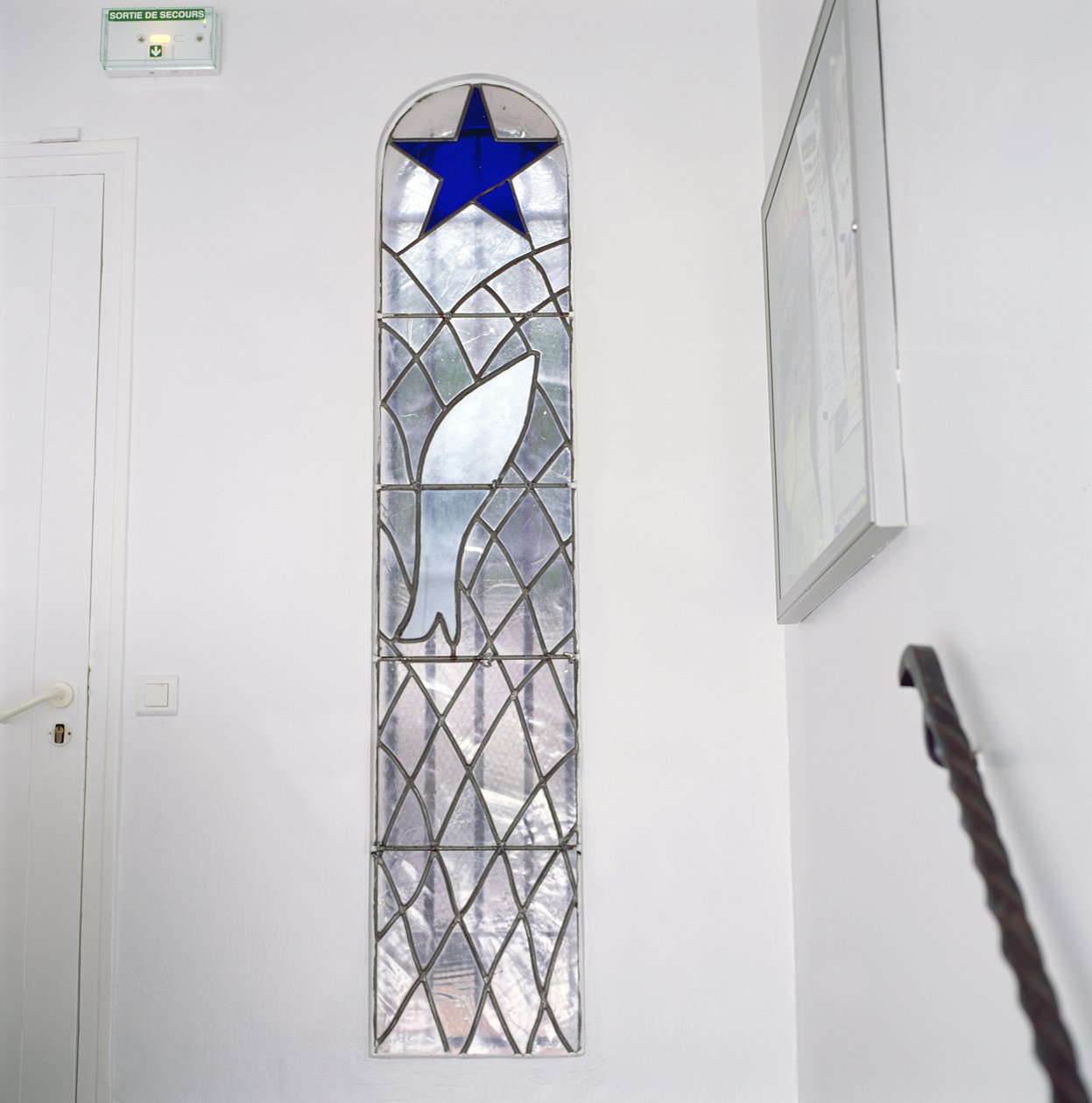 Stained Glass Window Depicting a Fish Caught in a Net Beneath the Star of Salvation, from the Stairs Leading to the Chapel of the Rosary by Henri Matisse