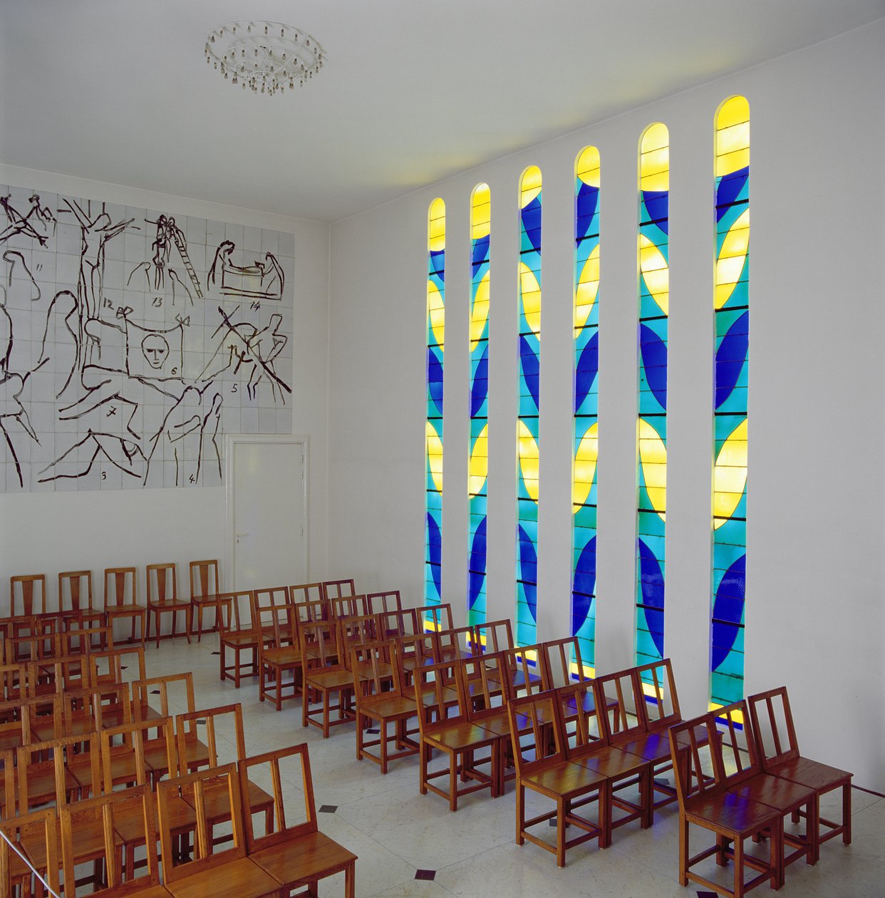 View of the Nave, Stained Glass Side Window and Stations of the Cross in the Chapel of the Rosary, Vence by Henri Matisse