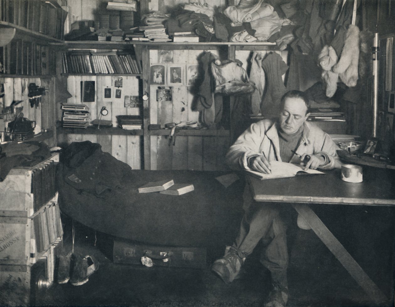 Captain Scott Writing His Diary in the Hut at Cape Evans by Herbert Ponting
