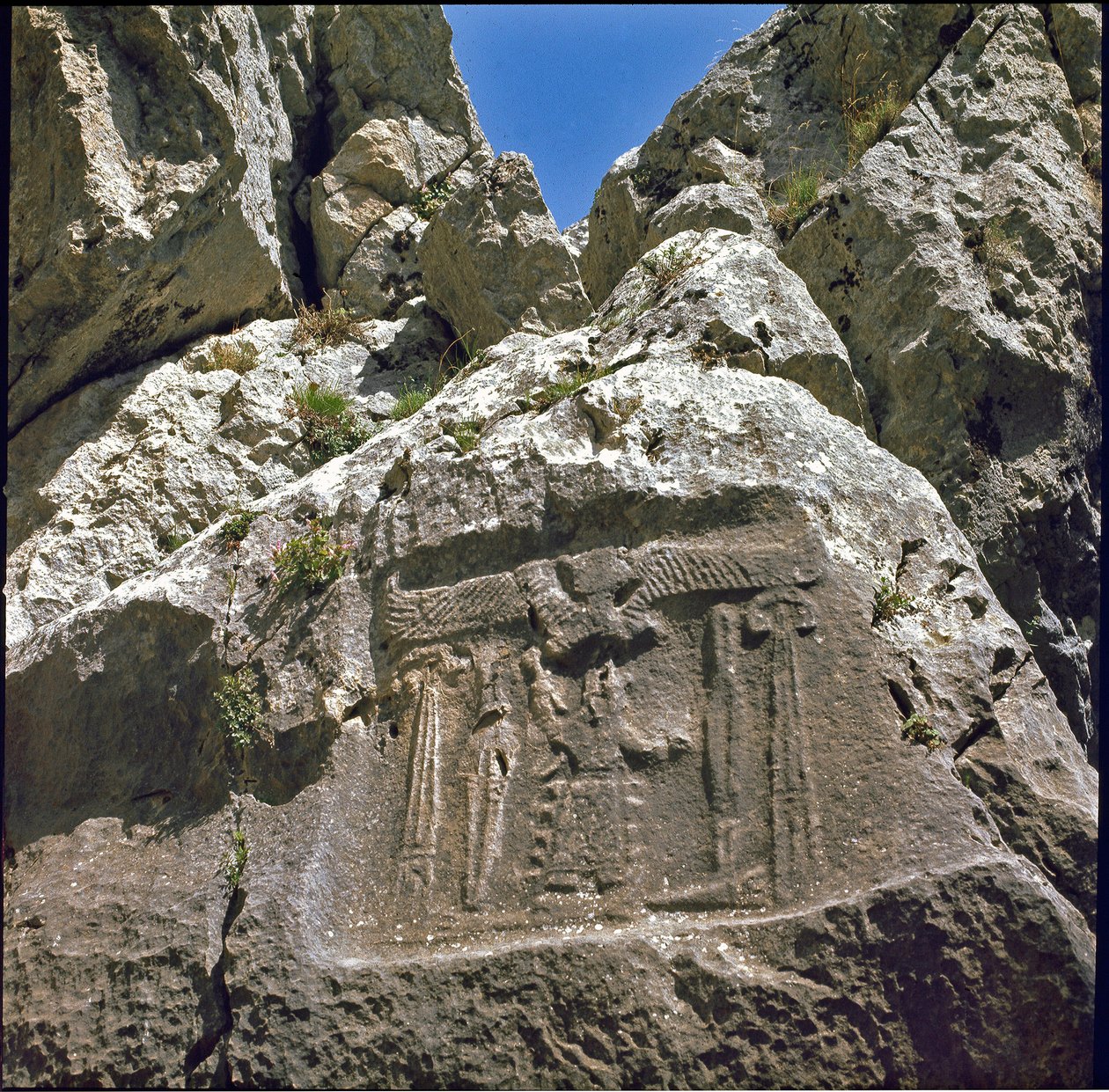 Low relief with a character under a winged creature by Hittite
