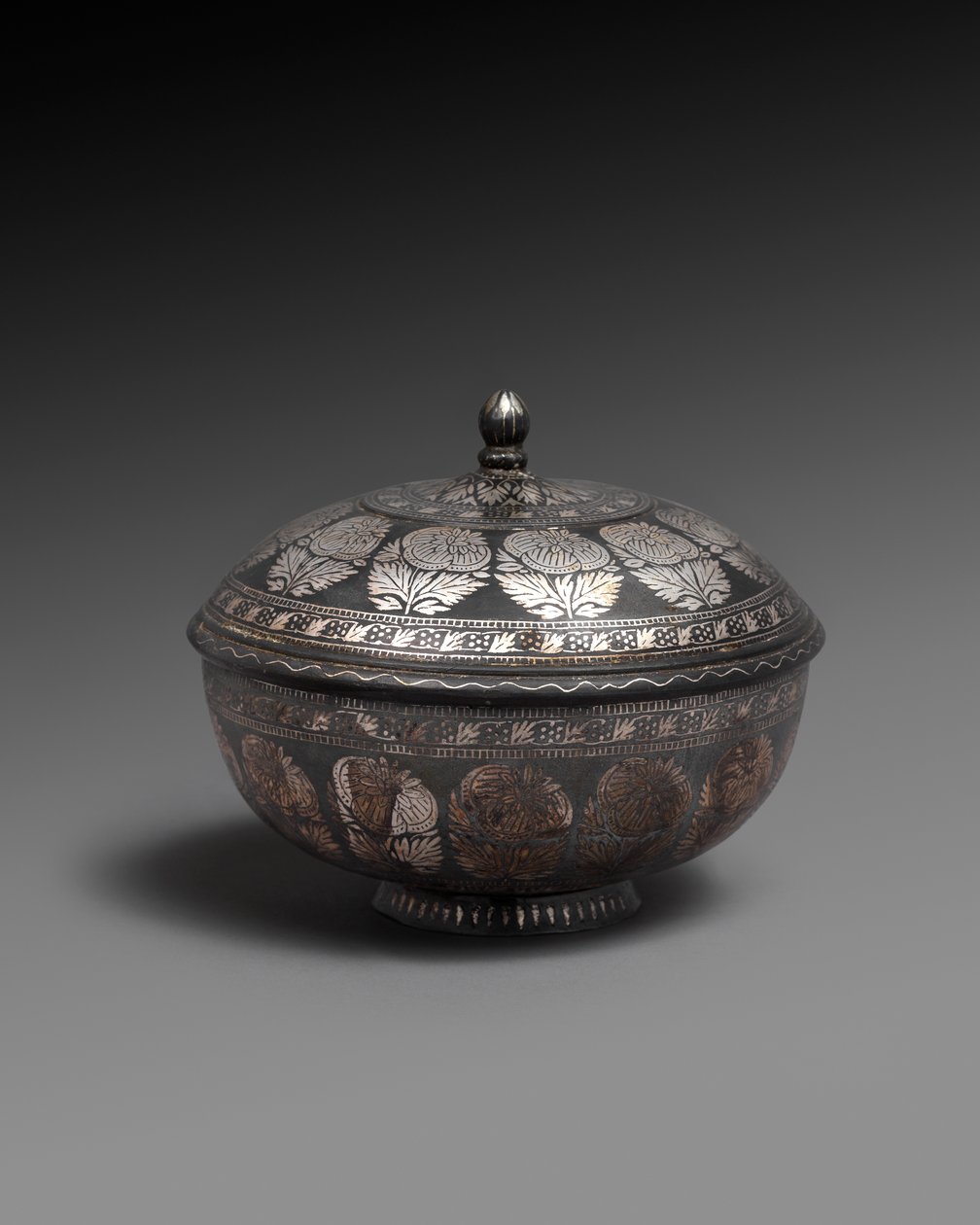Bowl and cover of metal alloy inlaid with silver, each with a band of naturalistic flowers by Indian School