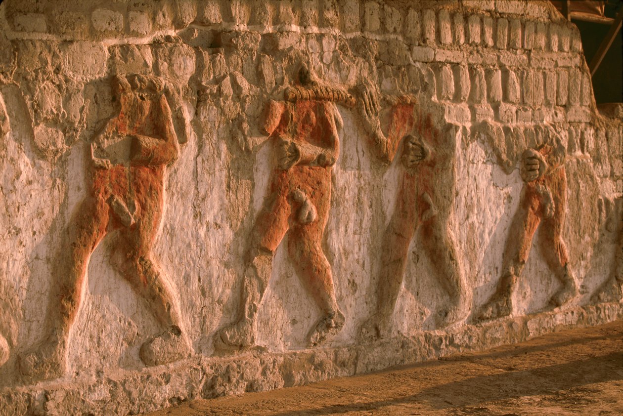 Frieze of naked prisoners of the Moche on the Huaca Cao Viejo walls in El Brujo by Ira Block