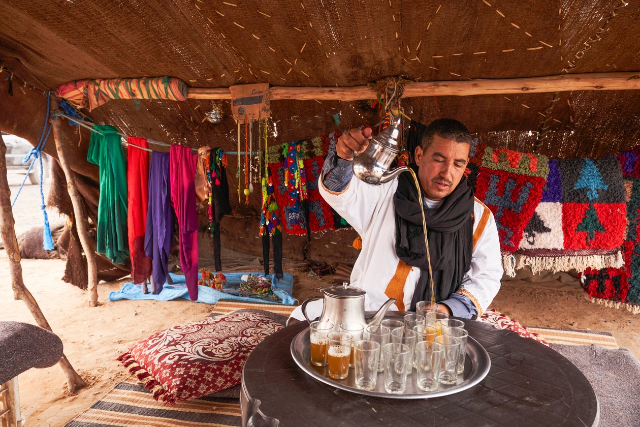 A local serving mint tea at Erg Chebbi in the desert near Merzouga, Morocco (photo) by Ira Block