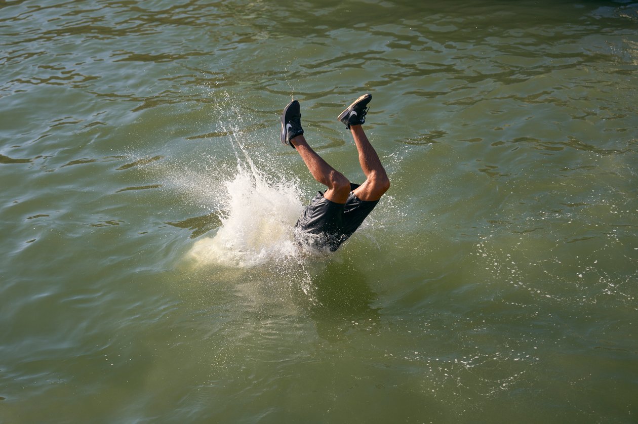 Man diving in the port of Essaouira, Morocco (photo) by Ira Block