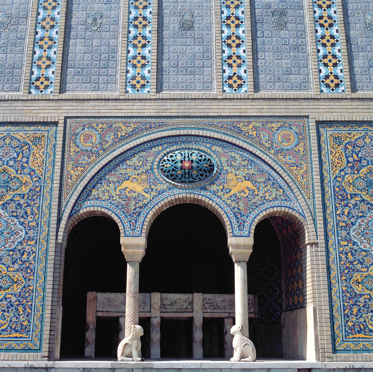 One of the aivans with tiled revetments, grille and monolithic stone columns by Islamic School