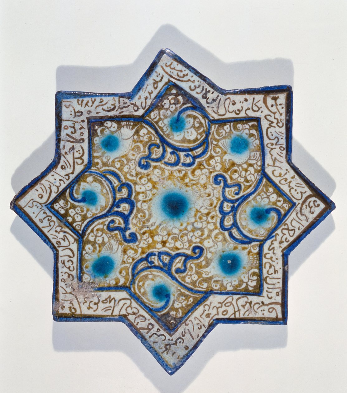 Star-shaped overglaze leaf-gilded tile in the style of Takht-e Solaiman by Islamic School