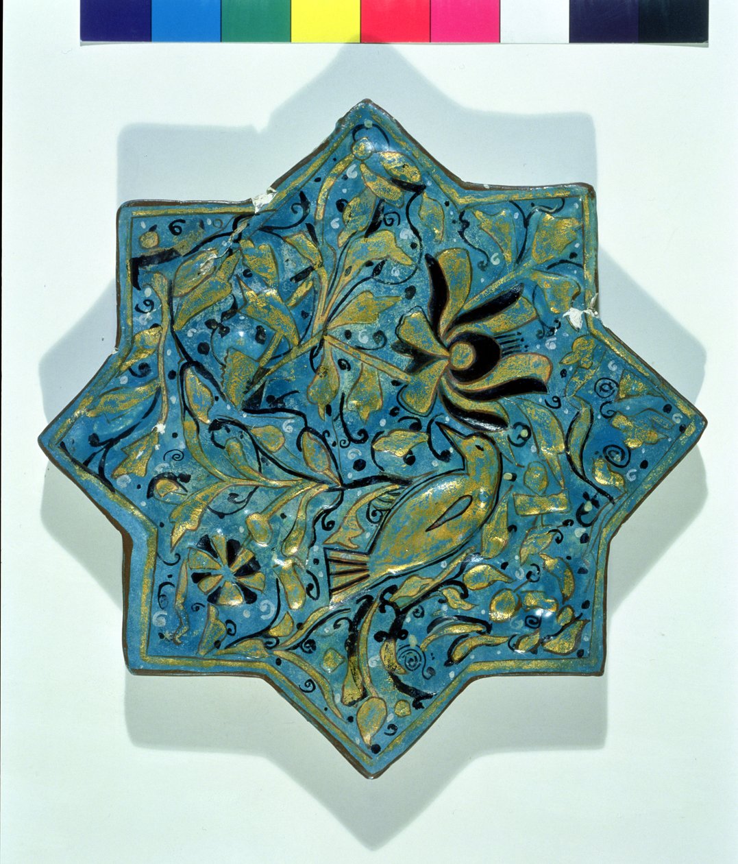 Star-shaped overglaze leaf-gilded tile in the style of Takht-e Solaiman by Islamic School