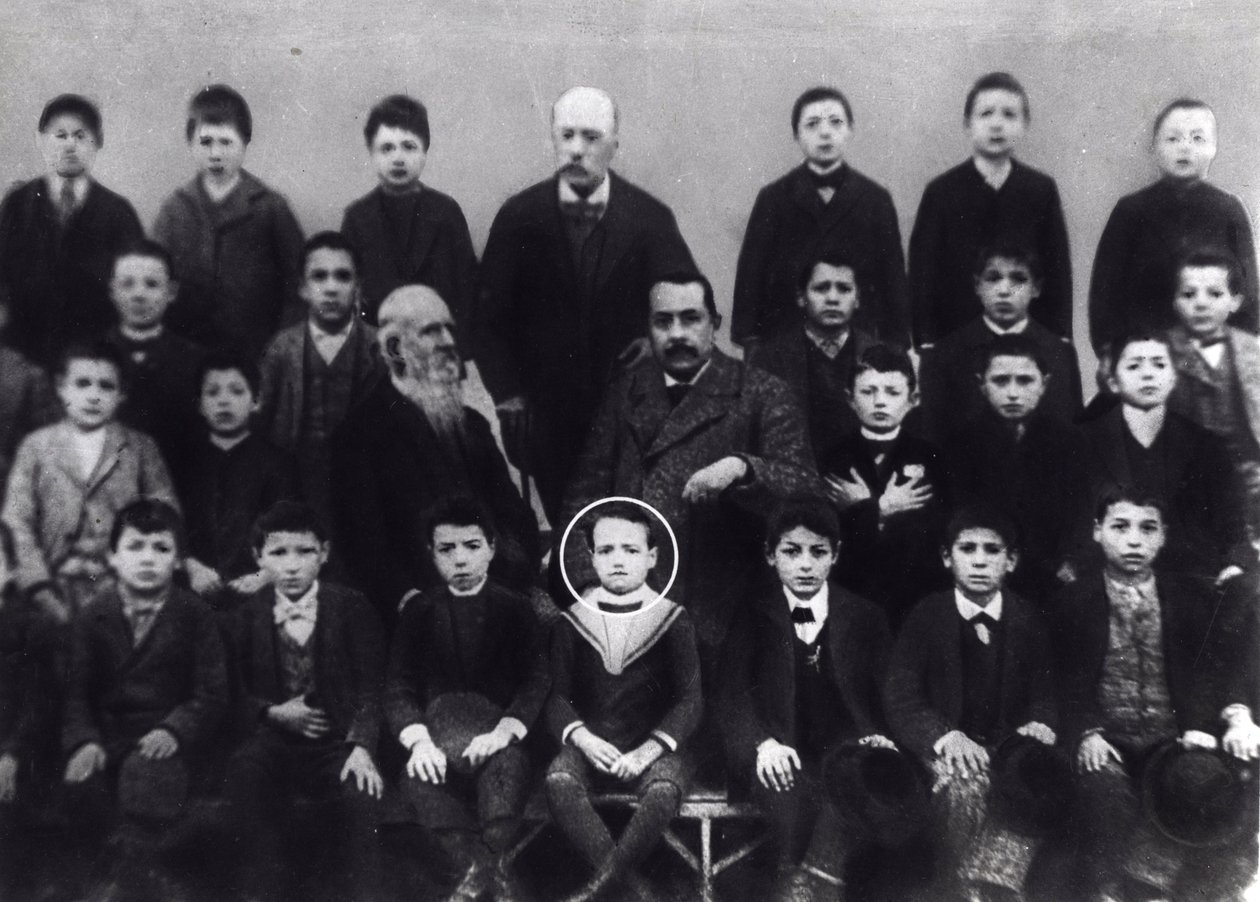 Benito Mussolini in elementary school - A portrait of Benito Mussolini with classmates and some teacher by Italian Photographer
