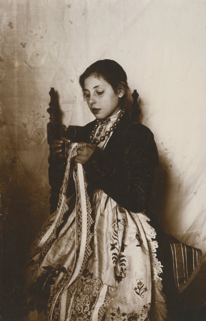 Young woman sewing, Tuscany, Italy, circa 1910 by Italian Photographer