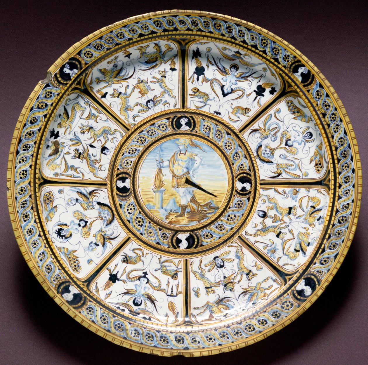 Representation of the Roman hero Scaevola (Muzio Scevola). Ceramic plate produced in Urbino, Italy. Circa 1590. National Museum of Bargello, Florence, Italy by Italian School