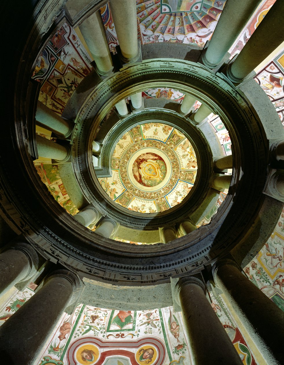 View of the stone spiral staircase looking up towards the ceiling, designed by Jacopo Vignola and his successors by Italian School