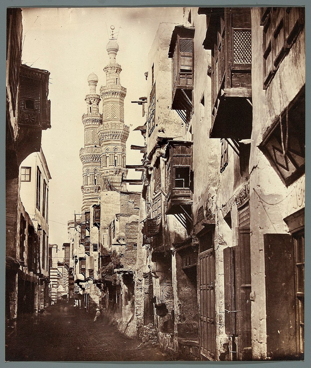 Egypt. Cairo. Alley - in the background minarets of the Mamluk mosque Al-Mu
