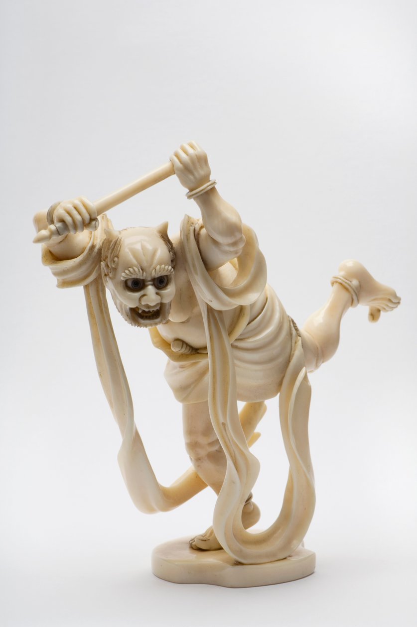 Okimono in the shape of a demon holding a stick by Japanese School