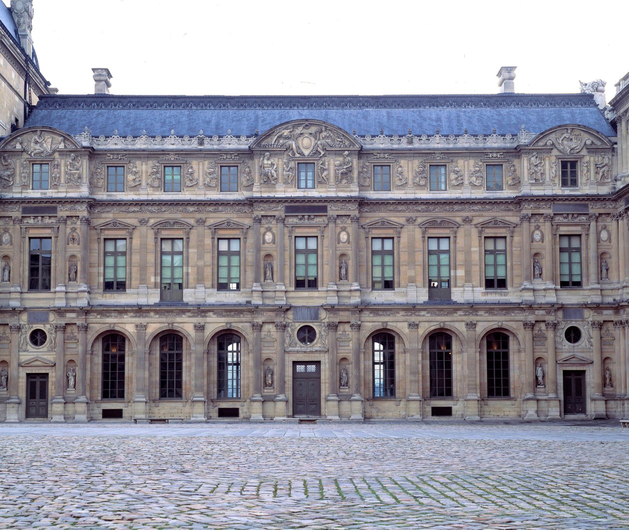 La cour carree du Louvre, facade du Louvre de Henri II, sculptures by Jean Goujon by Jean Goujon