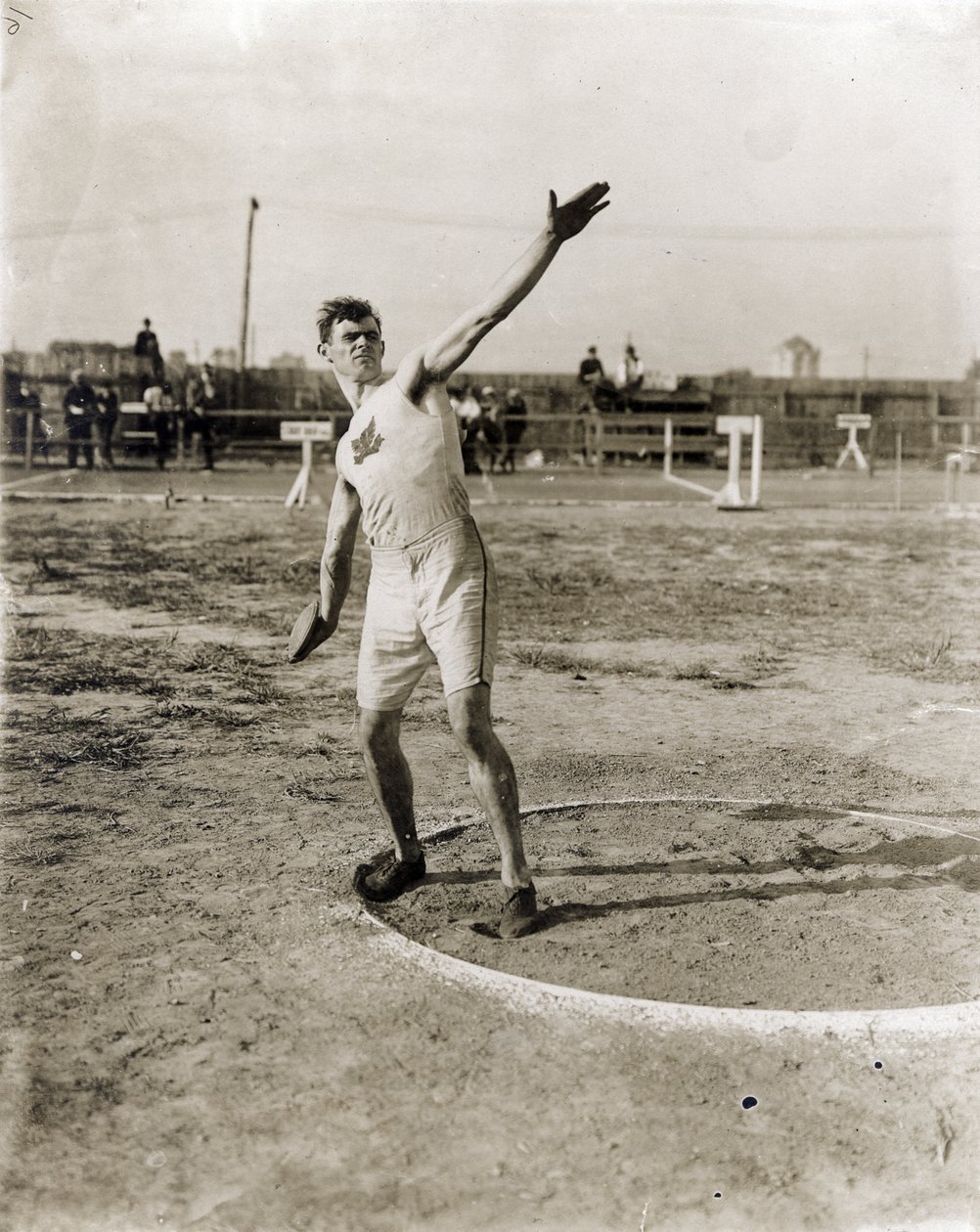 Martin Sheridan Throwing the Discus at the 1904 Olympics by Jessie Tarbox Beals