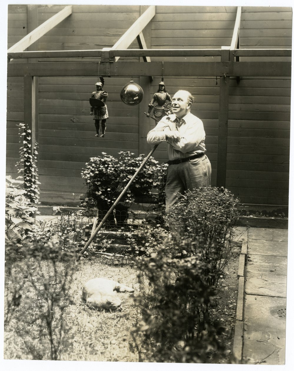 Tony Sarg in his garden by Jessie Tarbox Beals