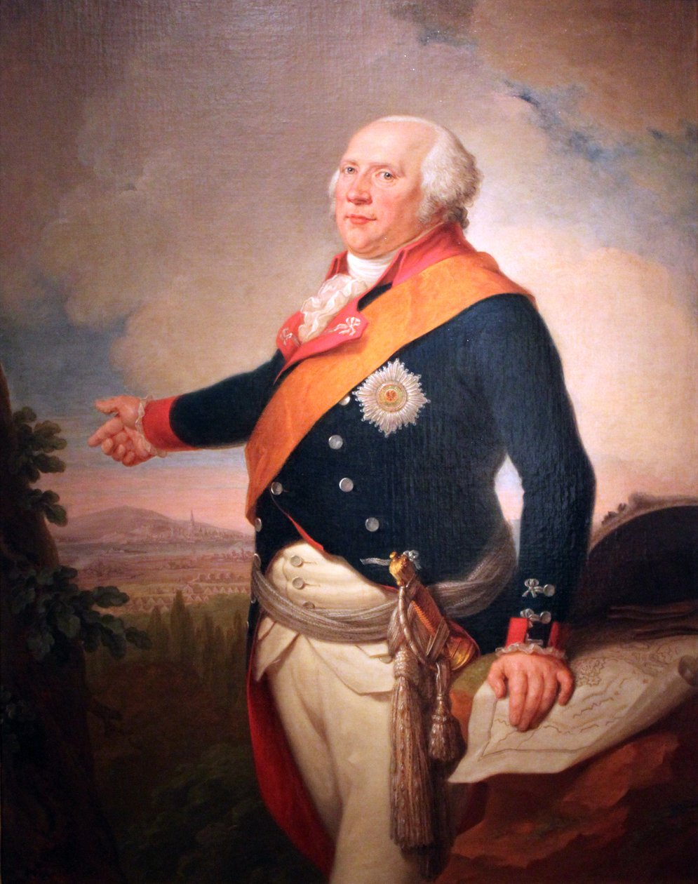 Portrait of King Frederick William II of Prussia (1744-1797) with a star of the Prussian Order of the Black Eagle, his left hand resting on a map of Frankfurt, a landscape with the Prussian army encamped outside Frankfurt by Johann Christoph Frisch