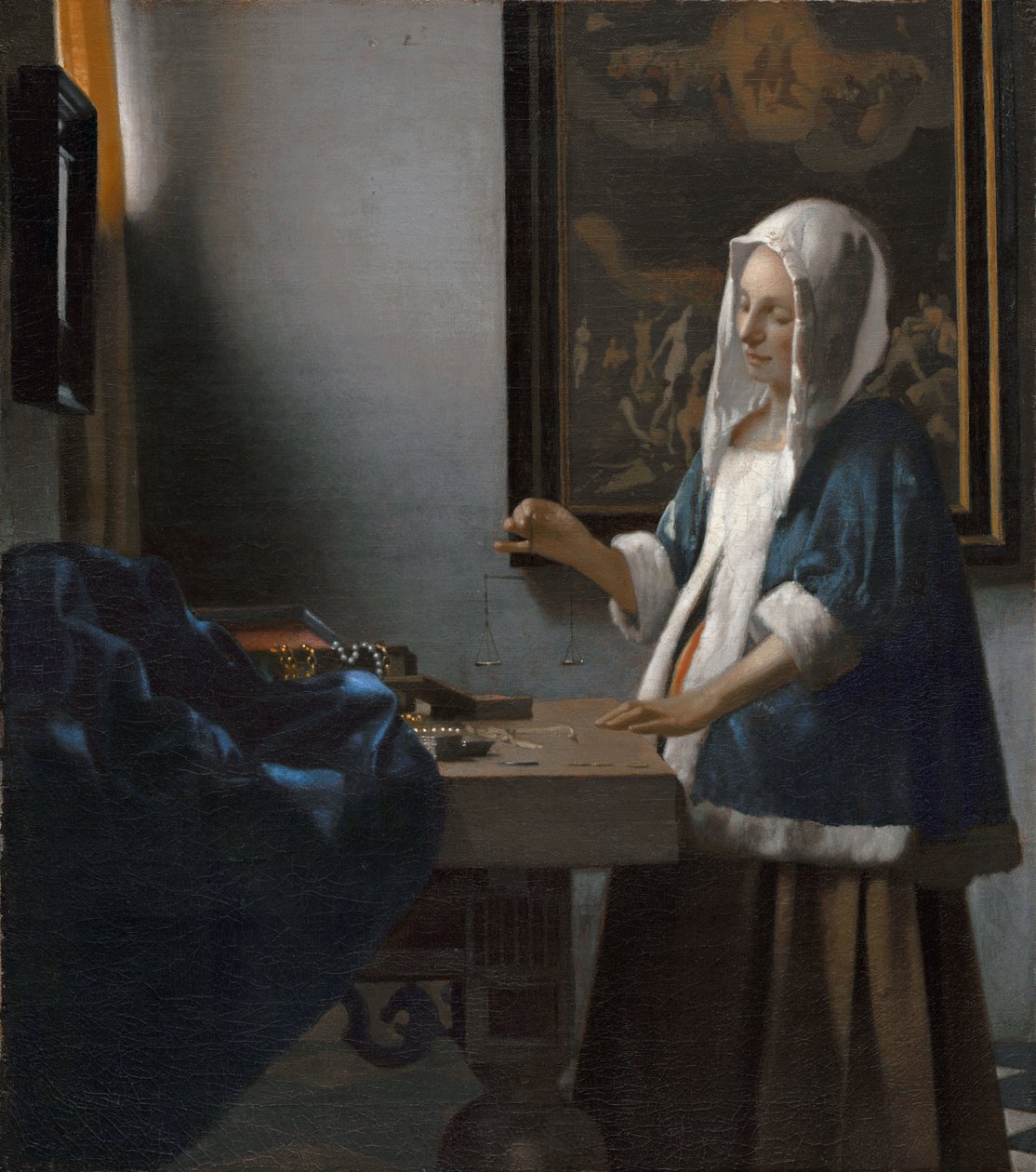 Woman Holding a Balance by Johannes Vermeer