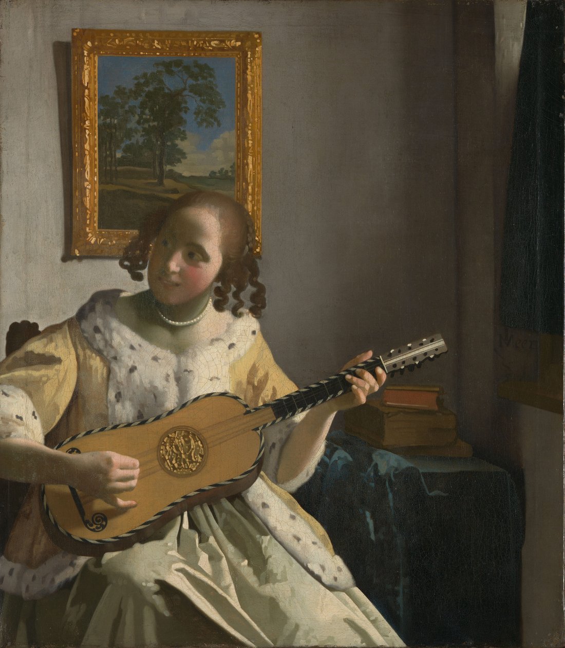 Young Woman Playing a Guitar by Johannes Vermeer