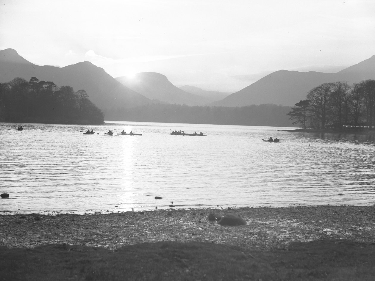A view of people canoeing on Derwentwater at either sunrise or sunset by Joseph Hardman