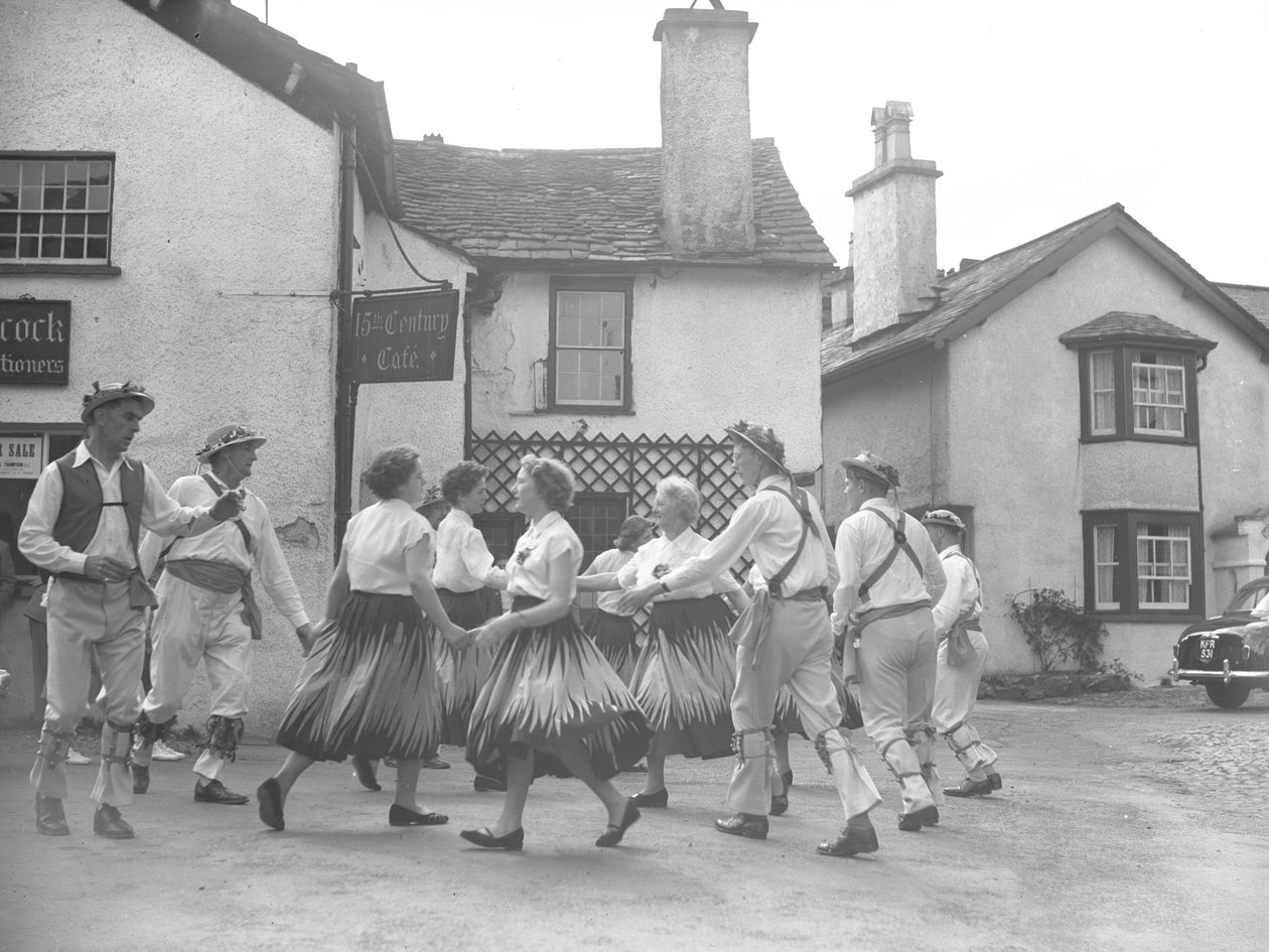 Men and women dancing at Hawkshead with sign for 