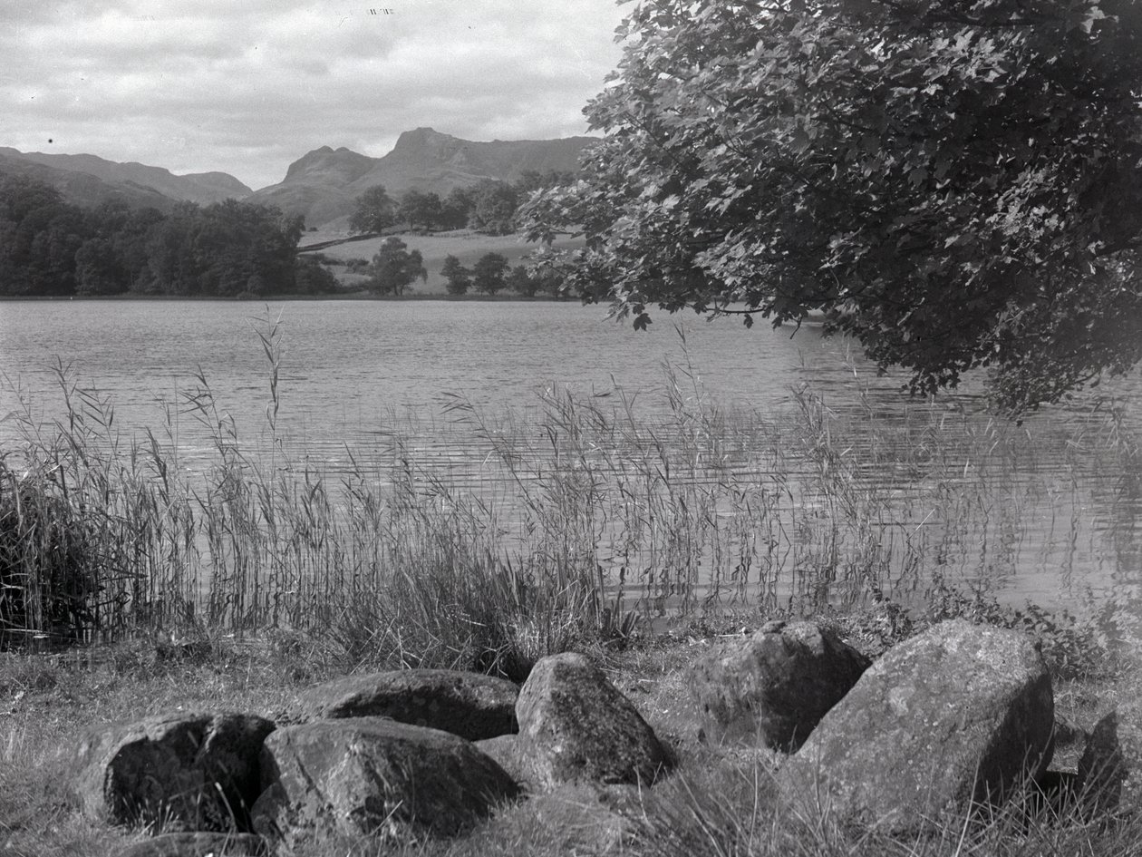 View across Loughrigg Tarn with stones in the foreground by Joseph Hardman