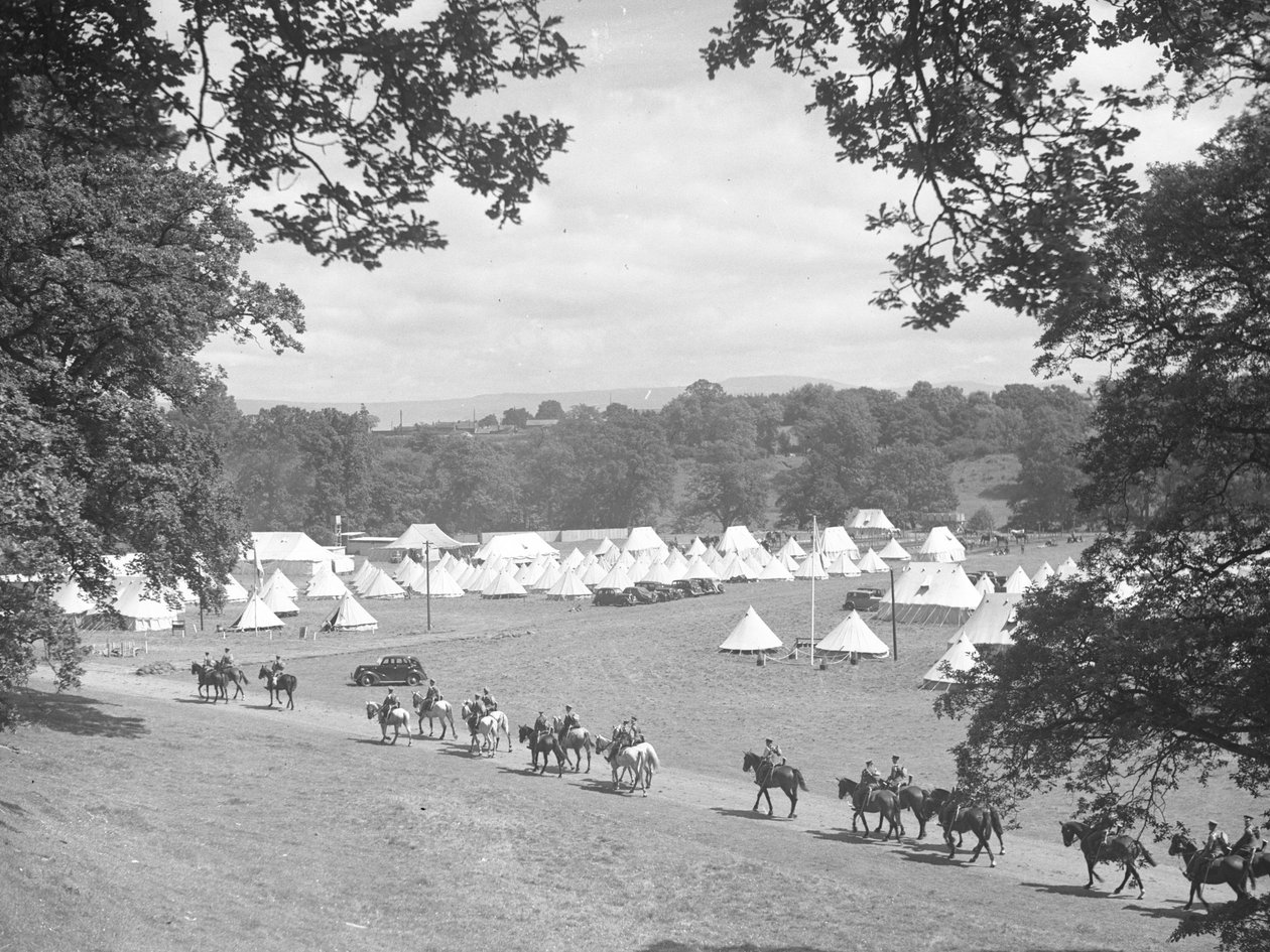 View of multiple cone-shaped tents, men in uniform on horseback (army?) by Joseph Hardman