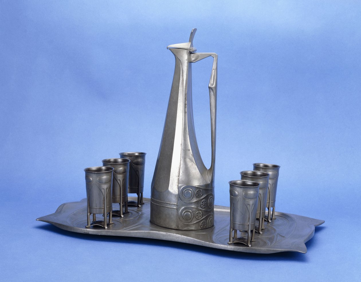An Edelzinn Eight Piece Pewter Liquor Set by Joseph Maria Olbrich