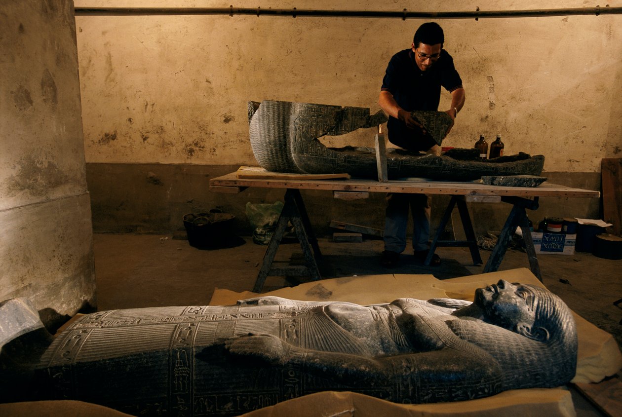 Fragments of the base of the sarcophagus of Senqed is reconstructed, New Kingdom by Kenneth Garrett