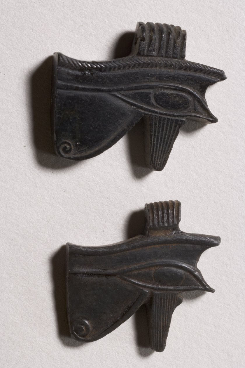 Two wedjat eye amulets by Late Period Egyptian