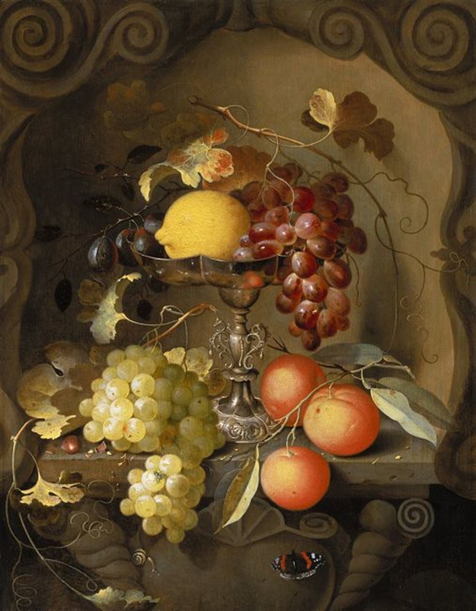 Still life of fruit on and around a tazza, in a niche by Laurens Craen