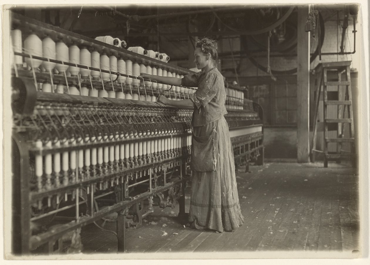 In an Old-Fashioned Textile Mill (Spinner) by Lewis W. Hine