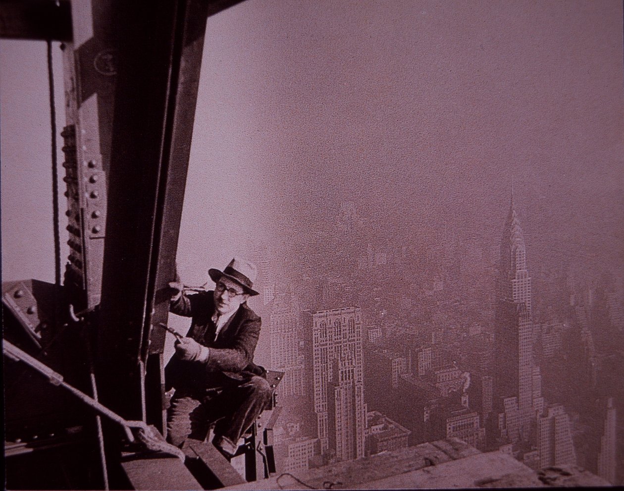 Empire State Building under construction, showing an inspector checking work by Lewis Wickes Hine