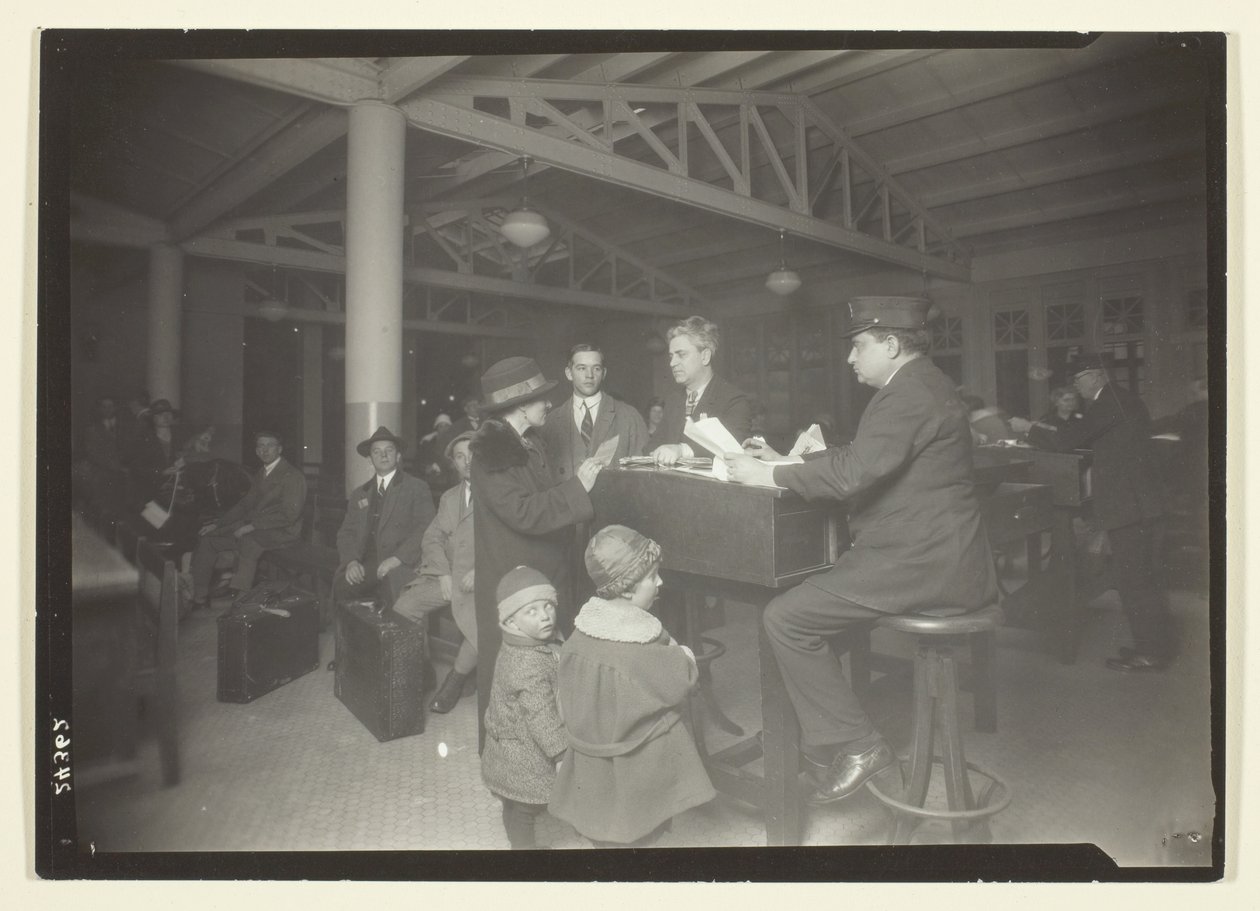 German Family, Interpreter and Recorder at Ellis Island by Lewis Wickes Hine