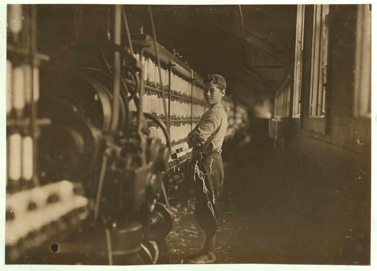 John Dempsey, 11 or 12 Years Old, Saturday Worker in the Mule-Spinning Room at Jackson Mill, Fiskeville, Rhode Island (1909) by Lewis Wickes Hine