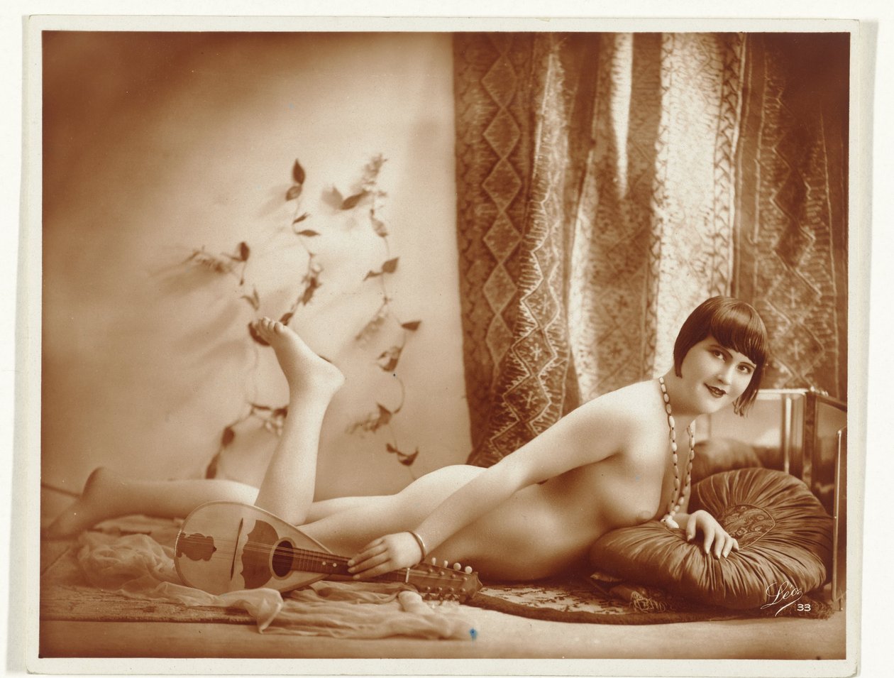 Reclining Female Nude with Mandolin by Léo