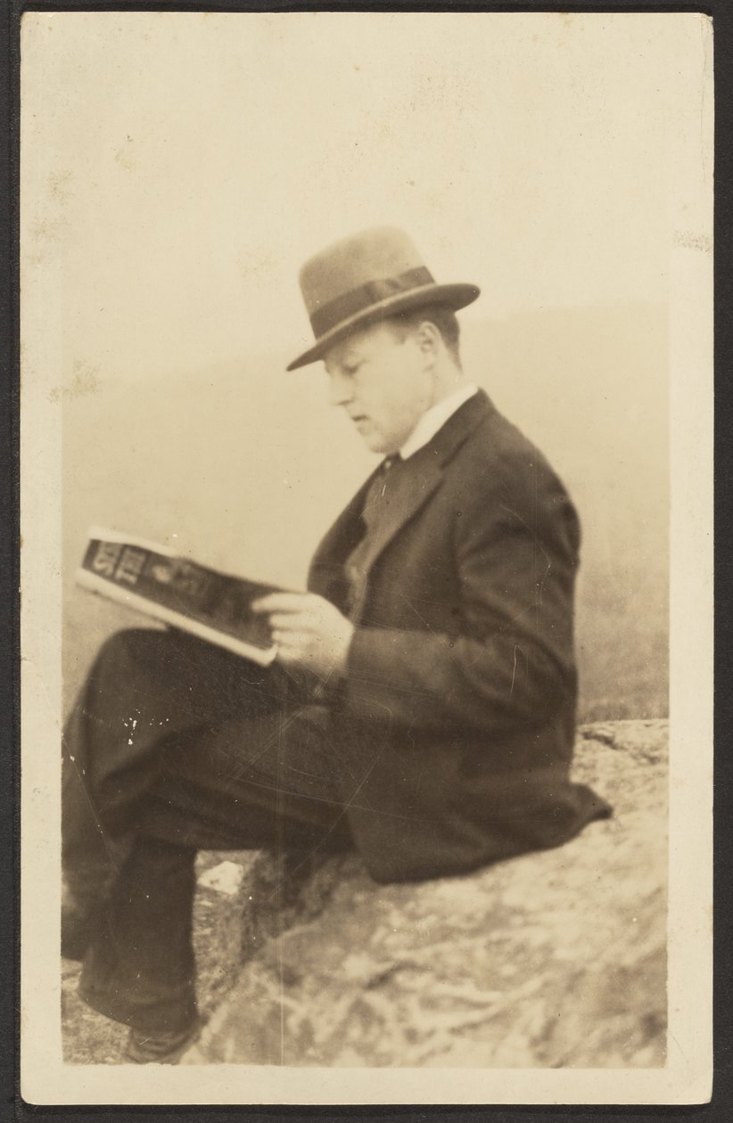 Man Reading Magazine on Rock by Louis Fleckenstein