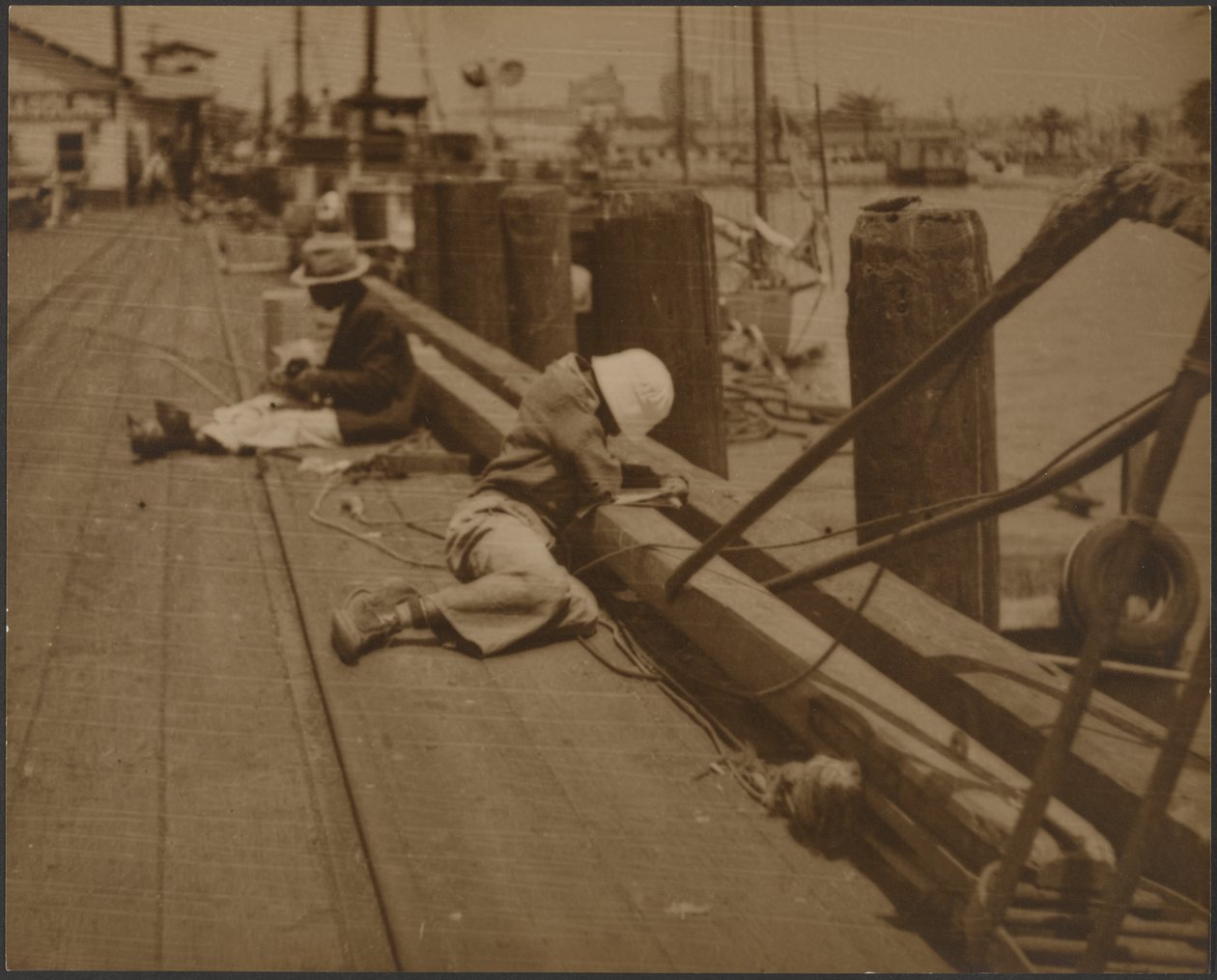 Men Seated on Dock by Louis Fleckenstein