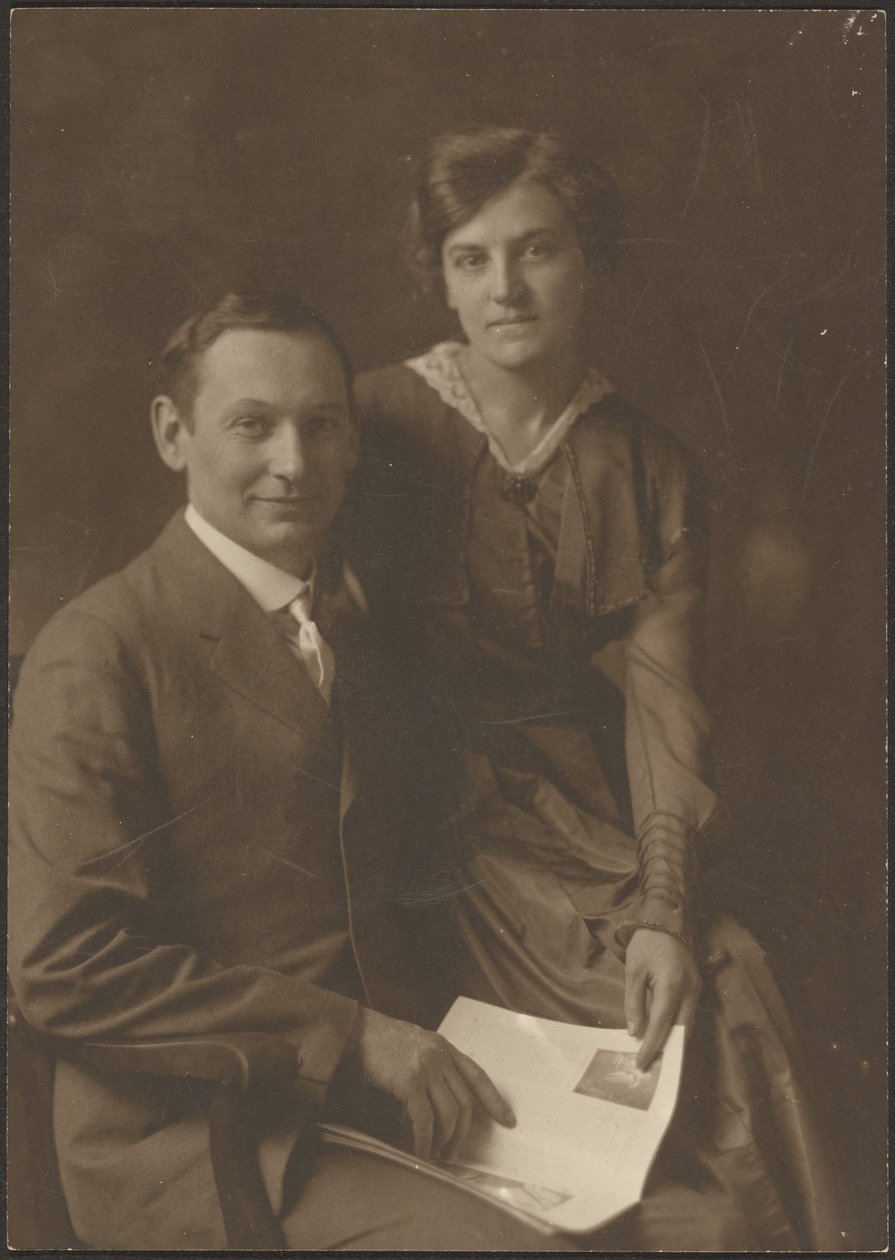 [Portrait of a Man and a Woman Holding a Magazine] by Louis Fleckenstein