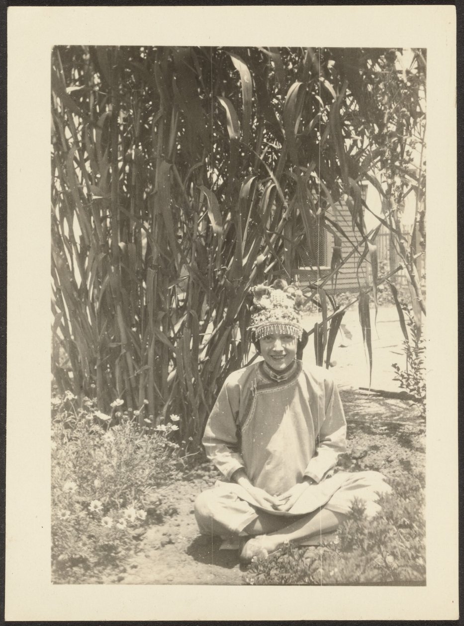 Woman in Costume Sitting in Garden by Louis Fleckenstein