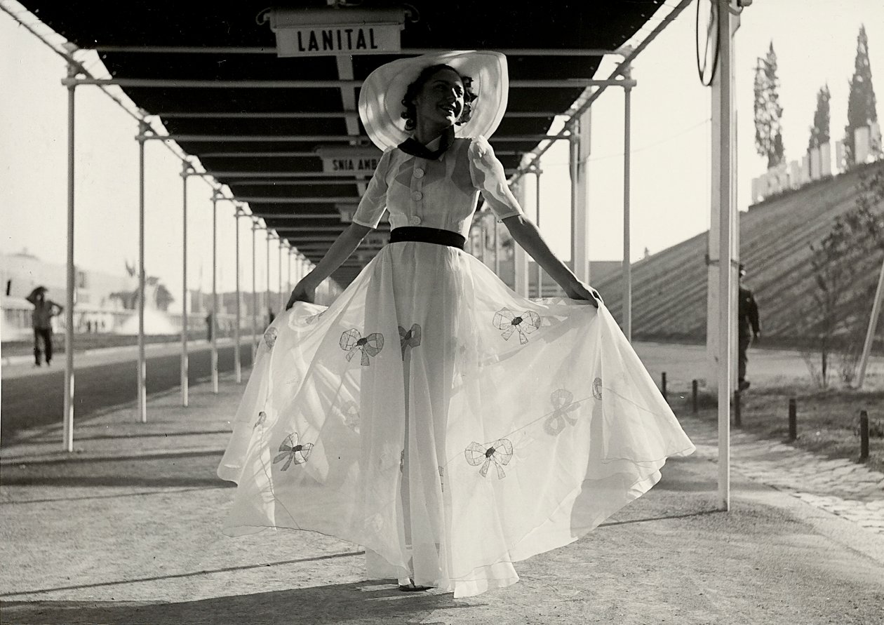 Model in a full summer dress created by the couture house Graldi by Luis Bogino