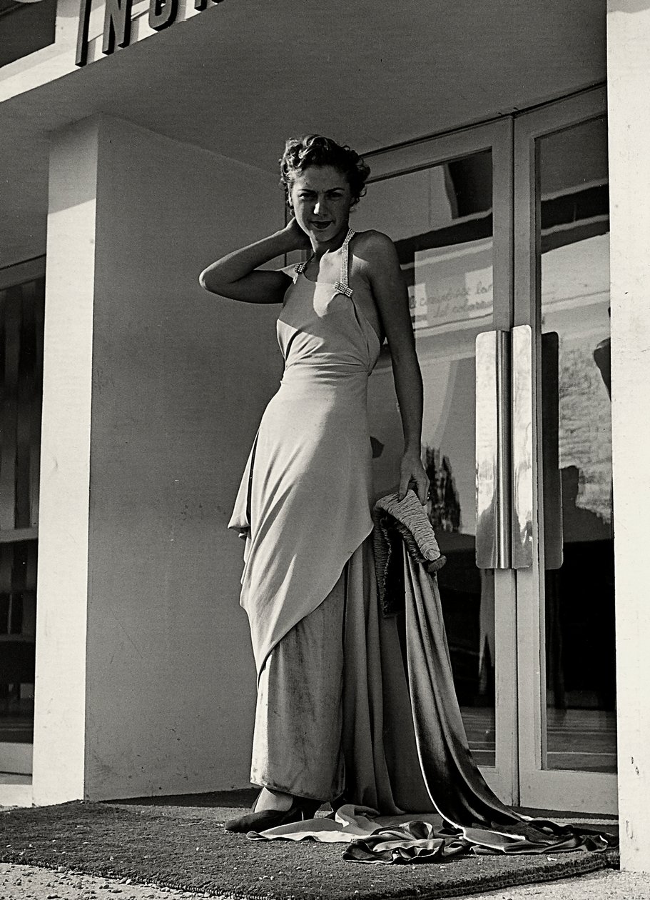 Model in evening dress created by the couture house "Graldi" by Luis Bogino