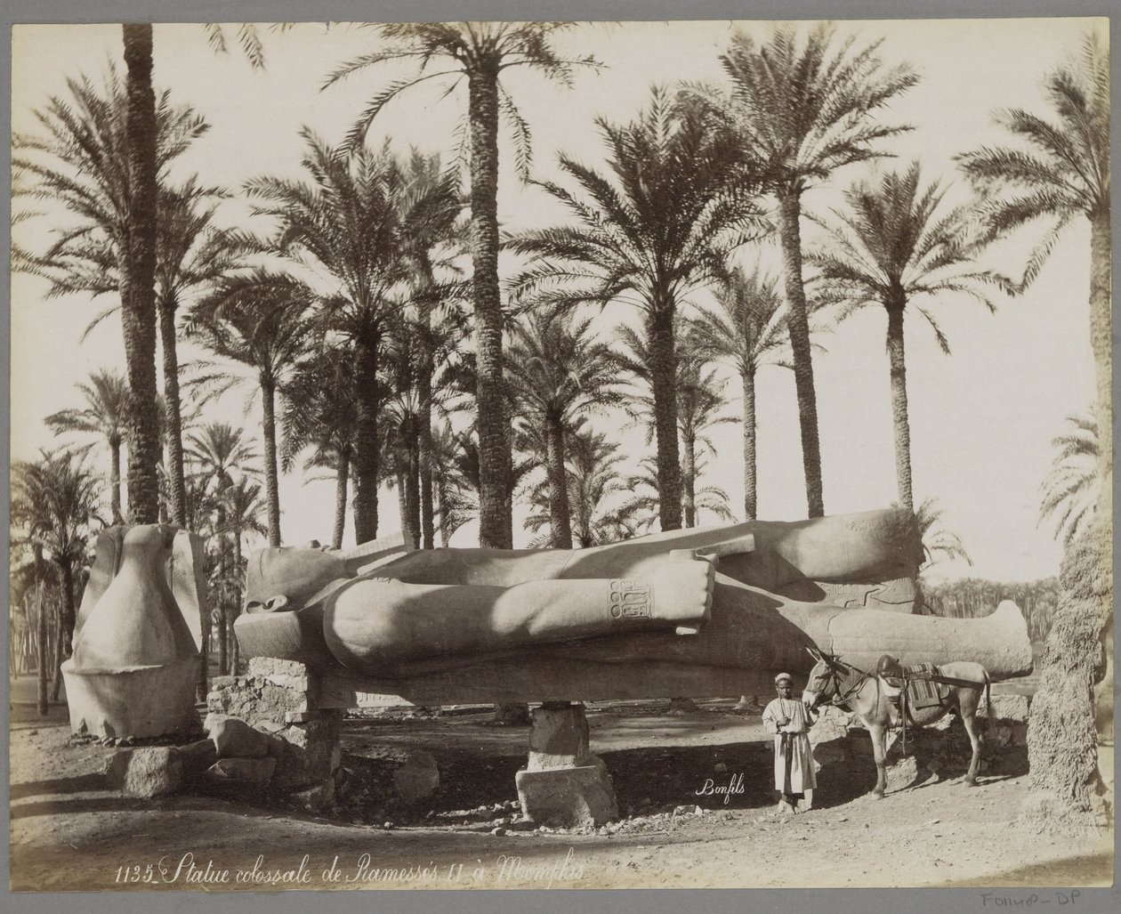 Reclining Statue of Ramses II in Memphis, with a Boy and a Donkey in the Foreground by Maison Bonfils