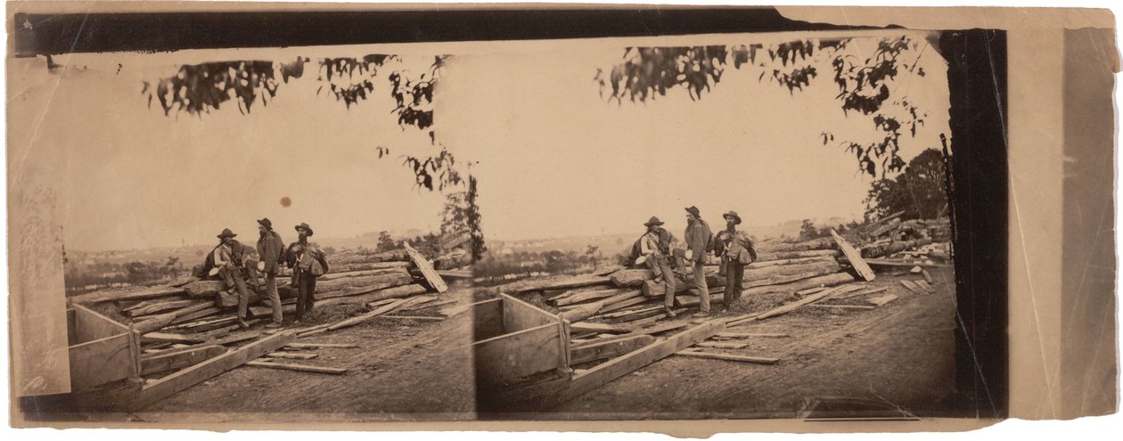 3 Rebel Prisoners behind Breastworks, 1863 by Mathew B. Brady